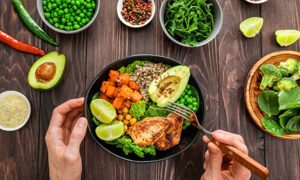 delicious-lunch-with-quinoa-avocado-sweat-potato-fried-chicken-seasoning-wooden-background-top-view