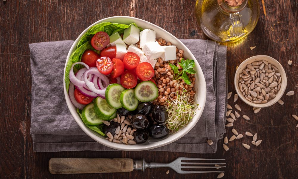 Healthy Greek salad in alternative version for people on diet. Nutritious bowl for fit people.