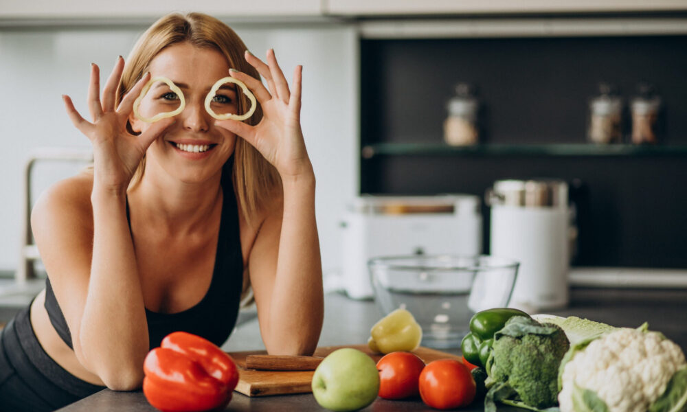 young-sporty-woman-with-pepper-kitchen